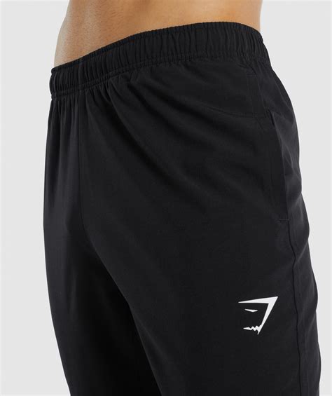 gymshark arrival woven joggers black.